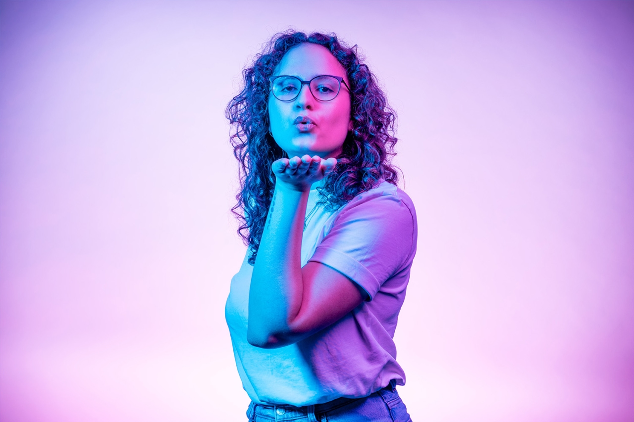 Woman throws kissing hand