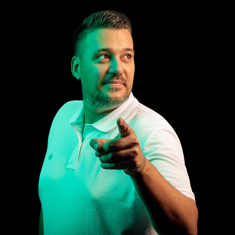 Man looks to the right and points forward