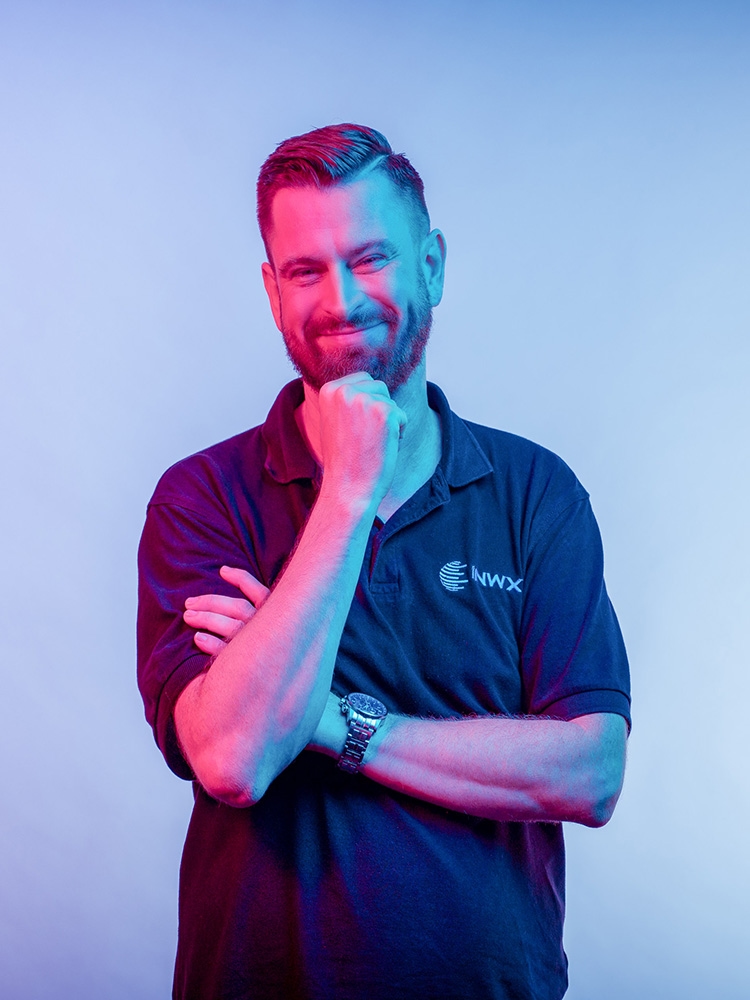 man holds his chin, pondering