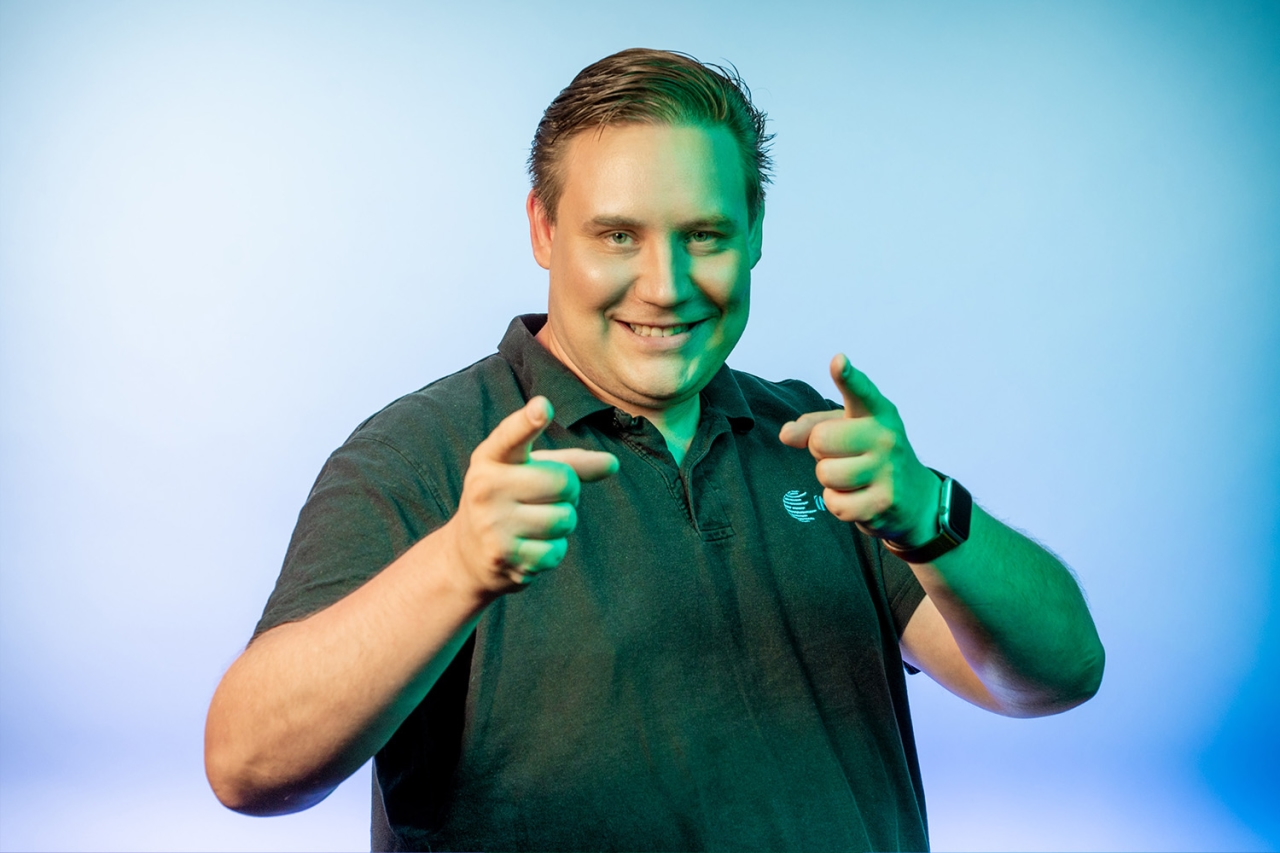 Man joyfully points forward