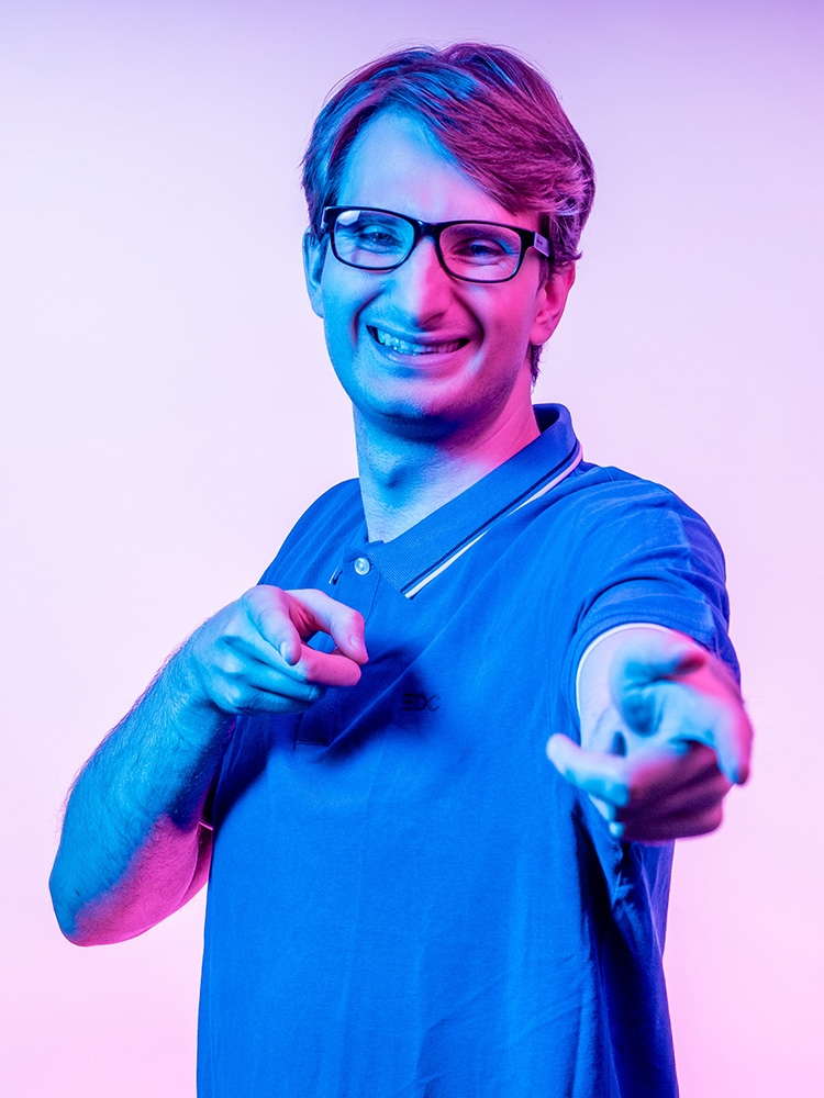 Man points forward with both hands