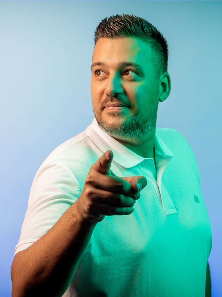 Man looks to the left and points forward