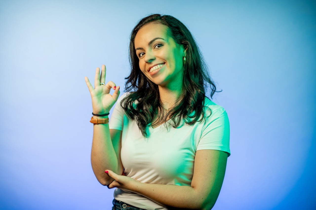 Woman shows OK with index finger and thumb
