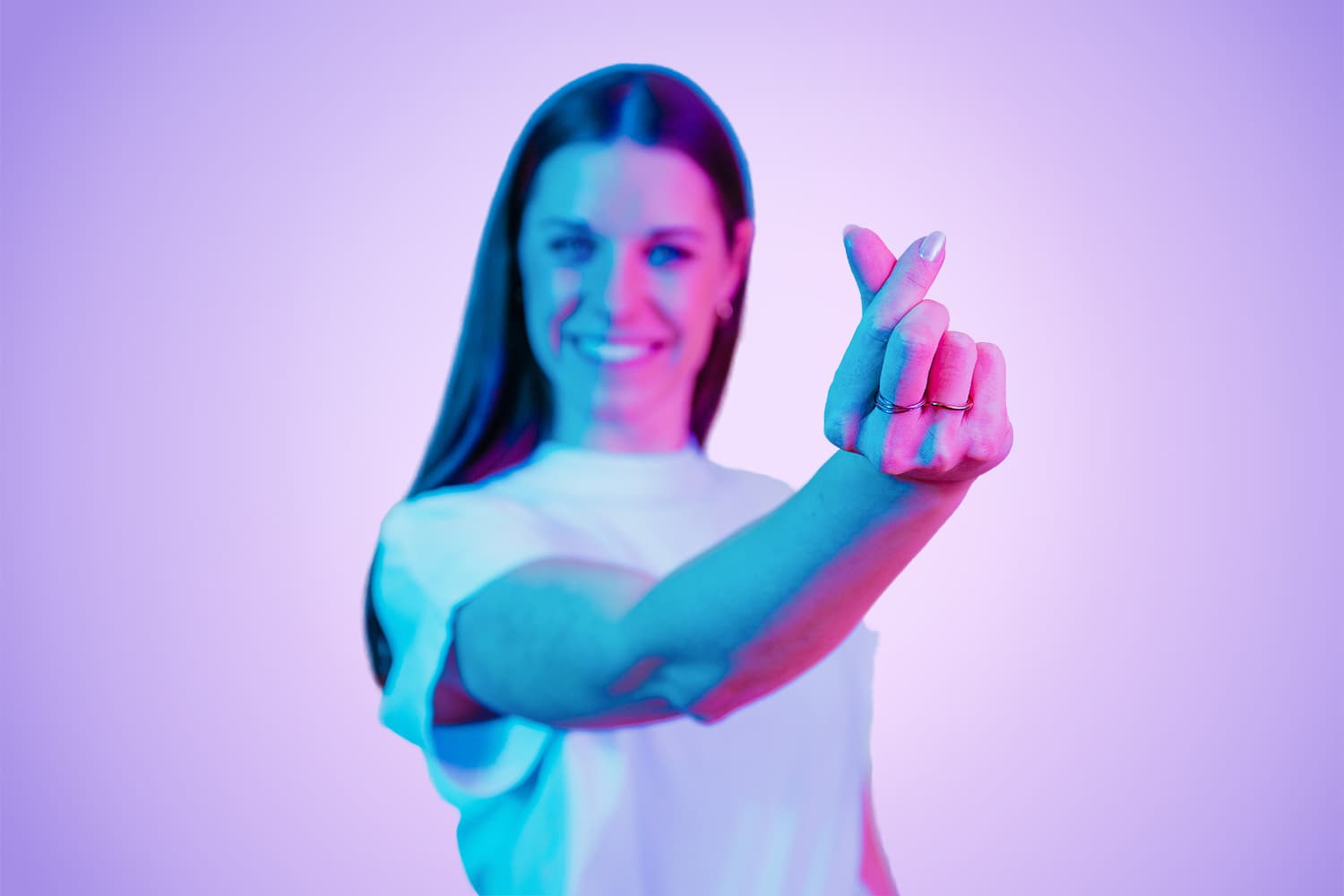 Woman holds her hands to her head