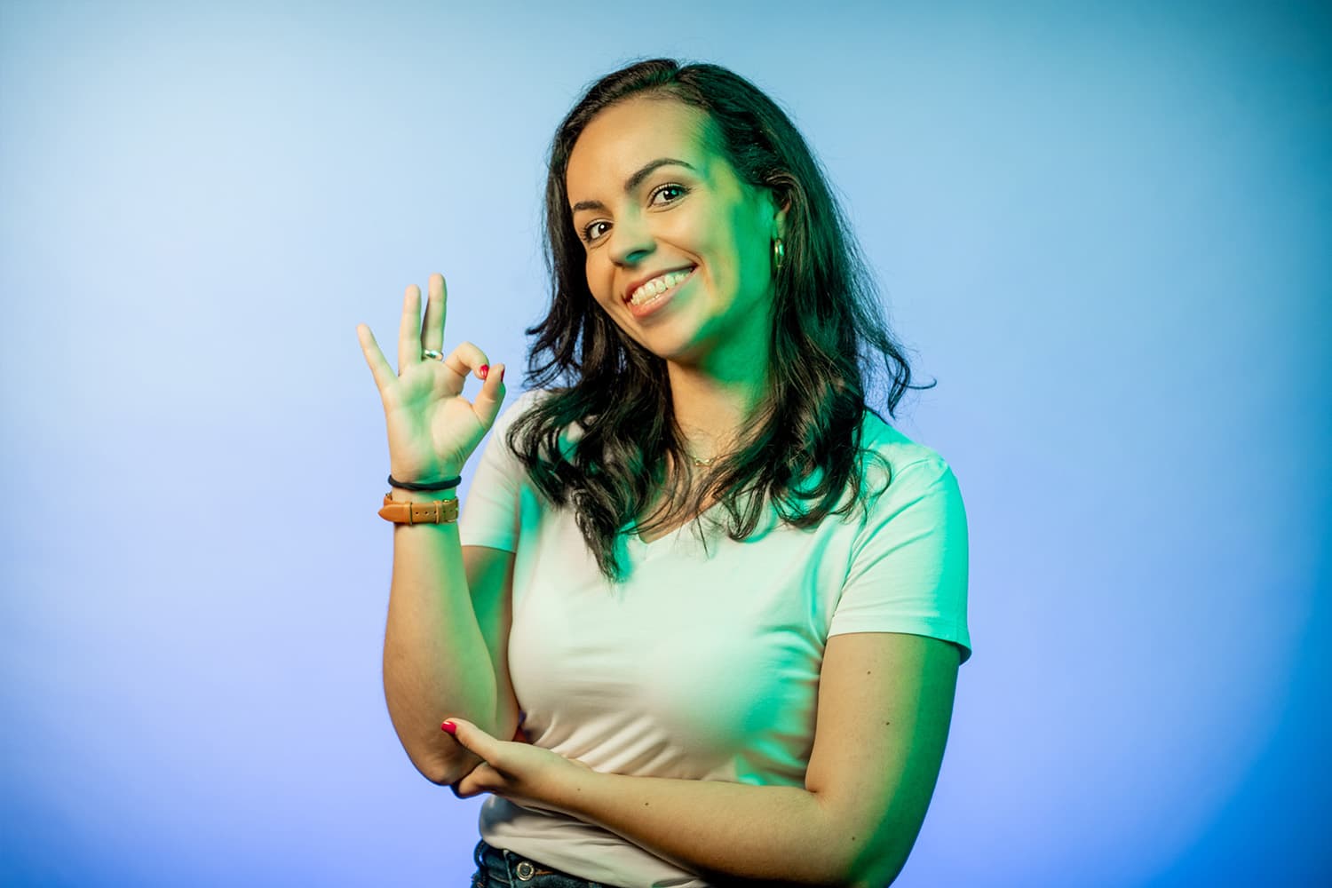 Woman shows OK with index finger and thumb