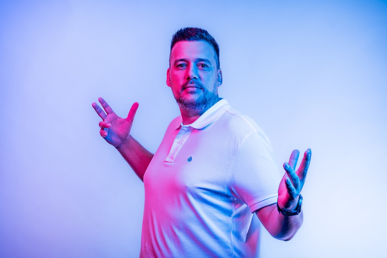 Man looking in to the camera with open arms